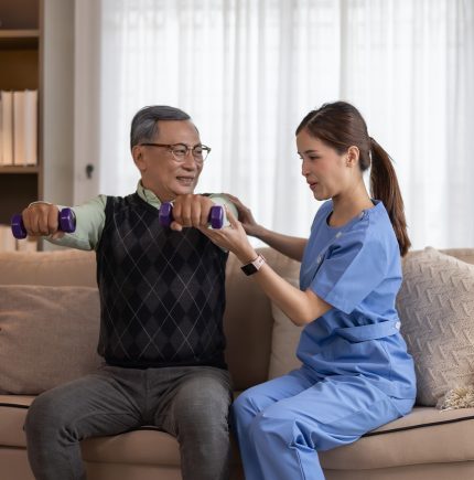 ElevateCare caregiver assisting client with exercise